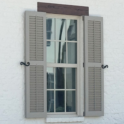 hinged exterior shutters that open and close