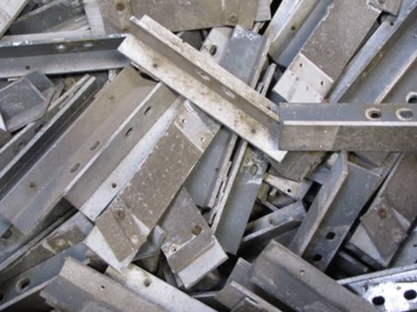 a pile of metal steel beams and some metal