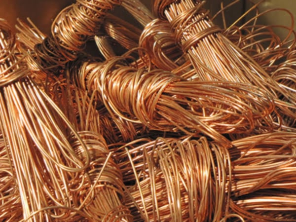 a pile of copper wire wrapped in copper foil