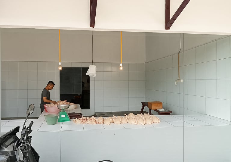 a man standing in a kitchen with a large counter top
