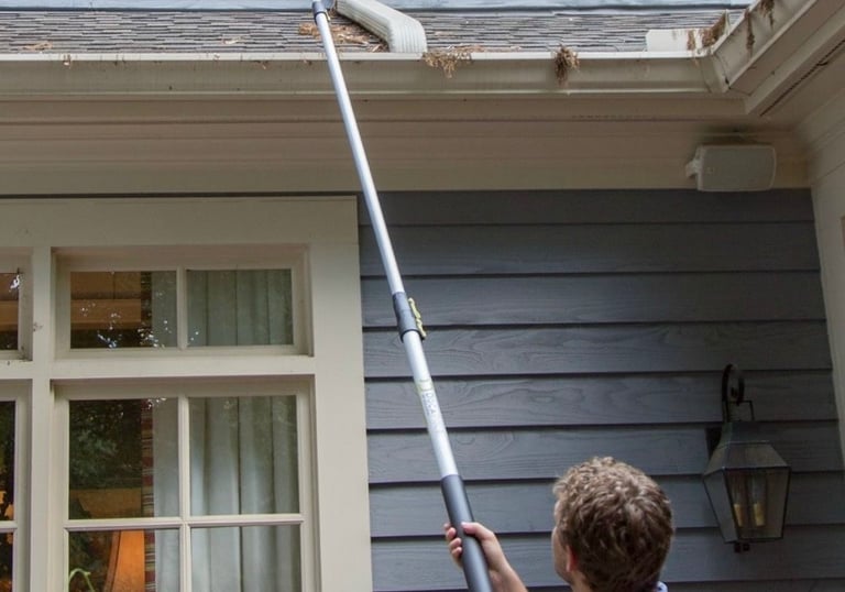 man cleaning windows for atlanta home