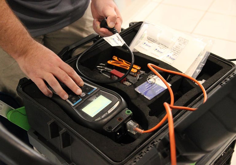 a man testing an electrical cable