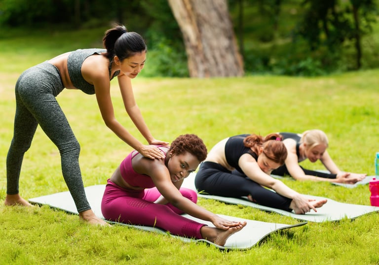 a woman in a yoga mat with a laptop and a water bottle