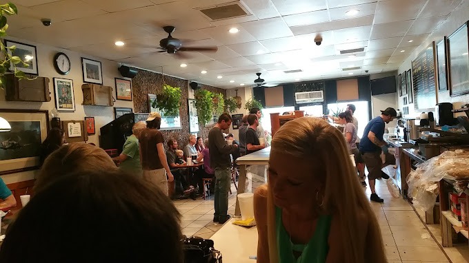 people standing in Hogan's Great Sandwich restaurant