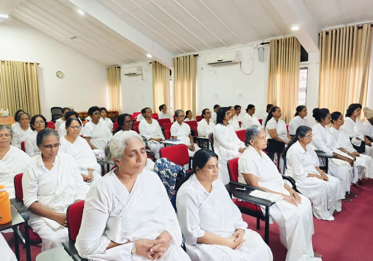 a group of people sitting in chairs in a room