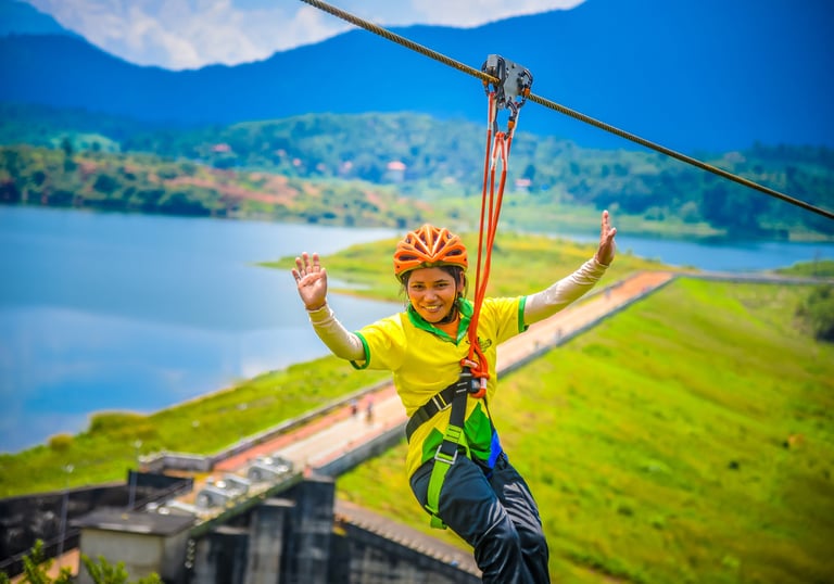 Thrilling ride on the longest zip line at Karapuzha Adventure Zone, offering spectacular views of th