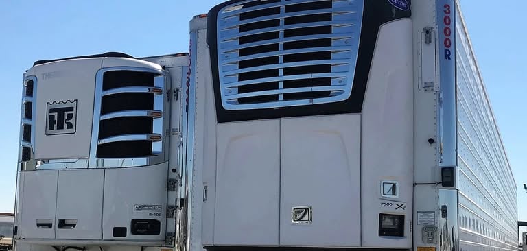 a truck with a large truck behind it
