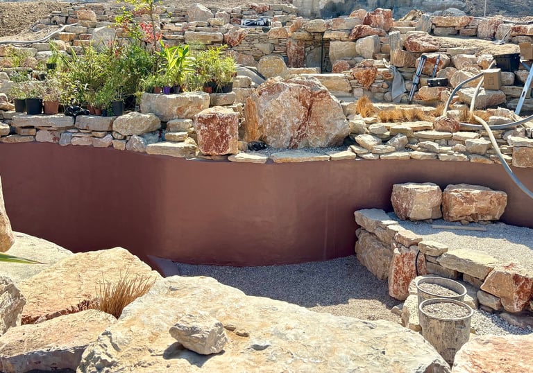 Natural pool with multiple levels, custom-colored walls & artisan stonework | Aqua Vitae build