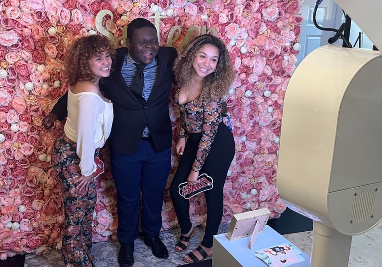 A group of teenagers using the studio photo booth