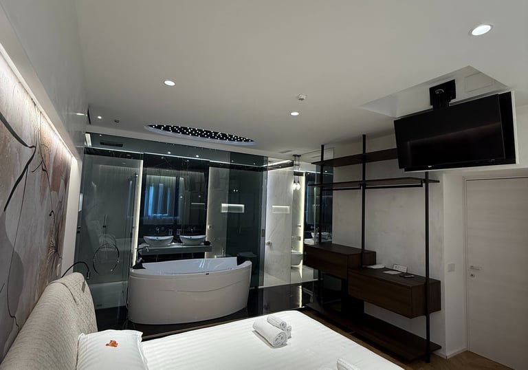 a bedroom with a bed and a bathtub