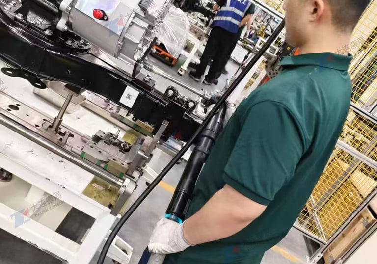 Dalian Kangzhan right-angle torque gun operating on e-drive axle assembly line