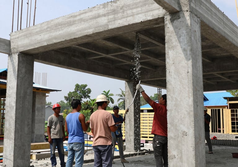 Construction workers building a modern house structure on site.