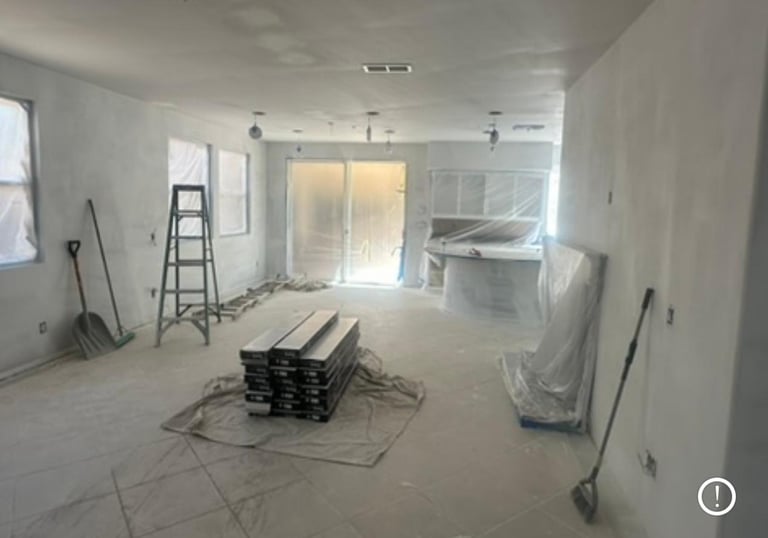 Home office renovation with a desk, chair, and building materials.