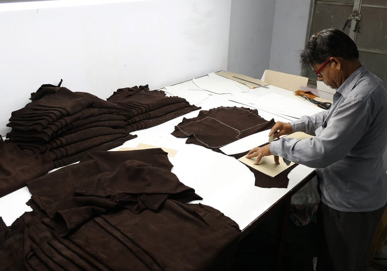 Man Cutting Leather