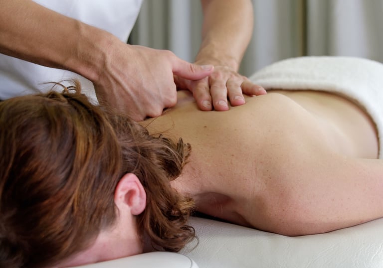a woman getting a deep tissue massage treatment