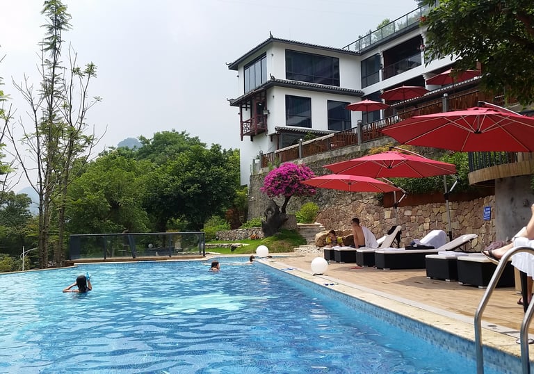 Relax by the pool whilst overlooking the Li River and Karst peaks