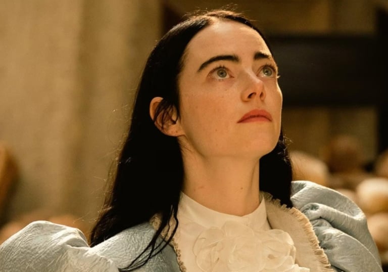 a woman in a blue jacket and white shirt