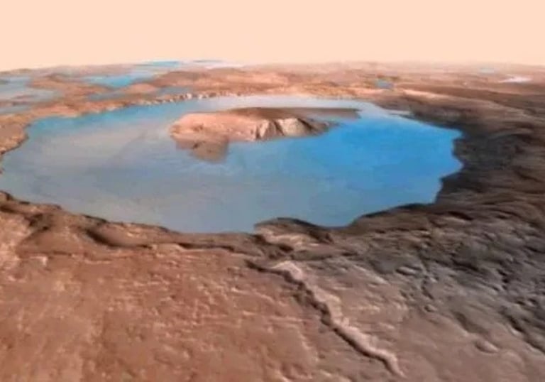 a large crater with a small pond in the middle