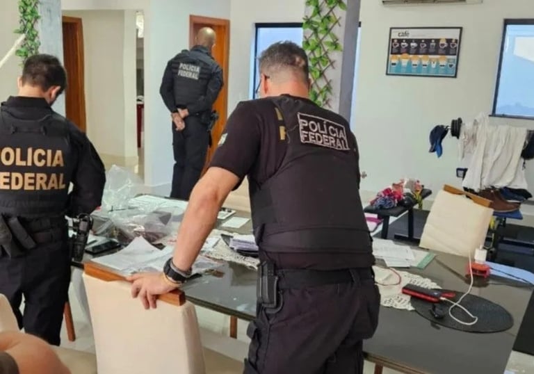 a police officer standing in a room with a table and chairs