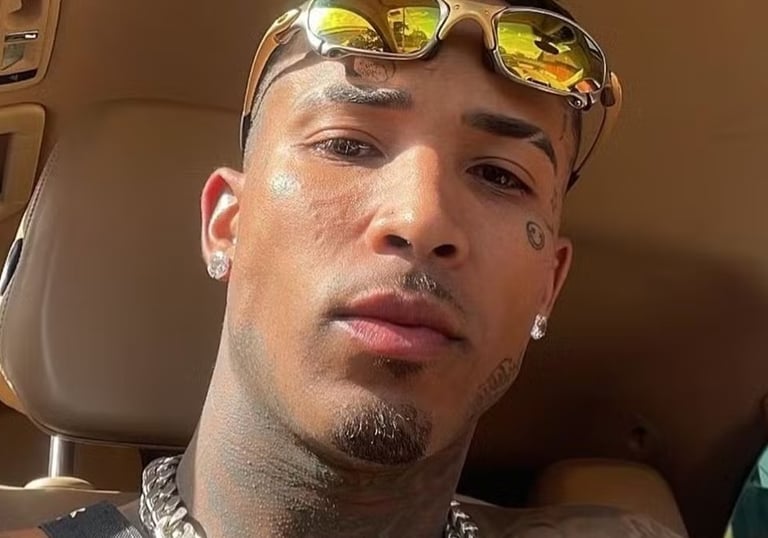 a man with sunglasses and sunglasses on his head