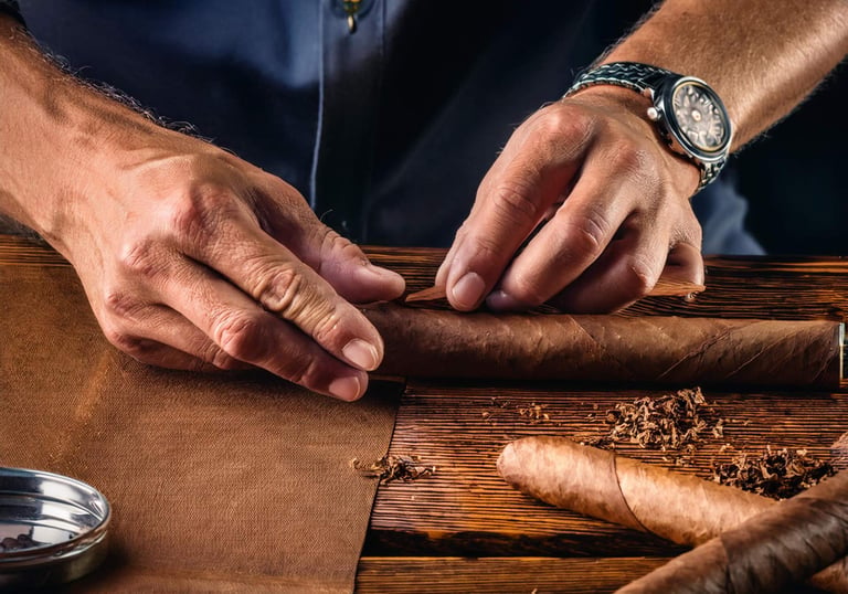 Image of a cigar roller's hands as he works on a cigar.