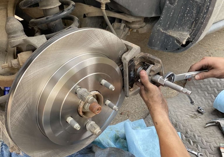 New brakes being installed by our technician