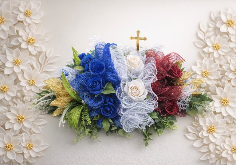 Patriotic floral arrangement with red, white, and blue roses, mesh ribbon, and a gold cross.
