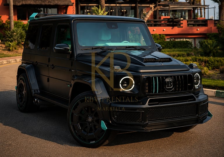 Matte black Brabus G-Wagon luxury SUV rental parked in front of a tropical resort in Marbella.