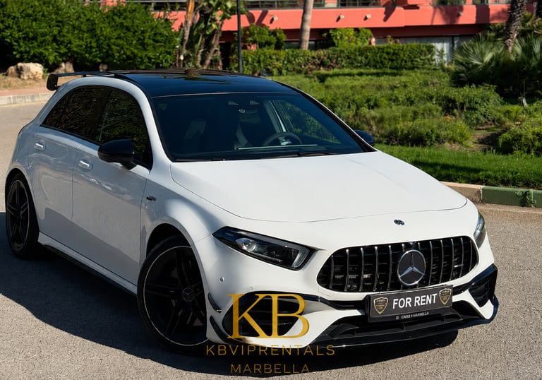 White Mercedes AMG A45 luxury rental car parked on a sunny street in Marbella.