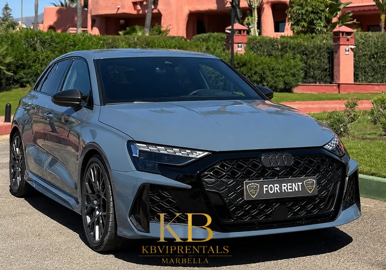 Luxury Audi RS3 sportback car rental in Marbella parked in front of a Mediterranean villa.