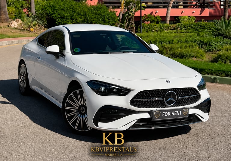 White Mercedes-Benz luxury car for rent in Marbella, featuring alloy wheels and a sleek coupe design.