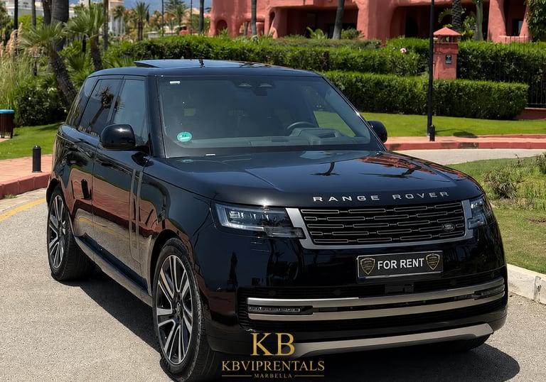 Luxury black Range Rover SUV for rent parked outside a tropical resort in Marbella.