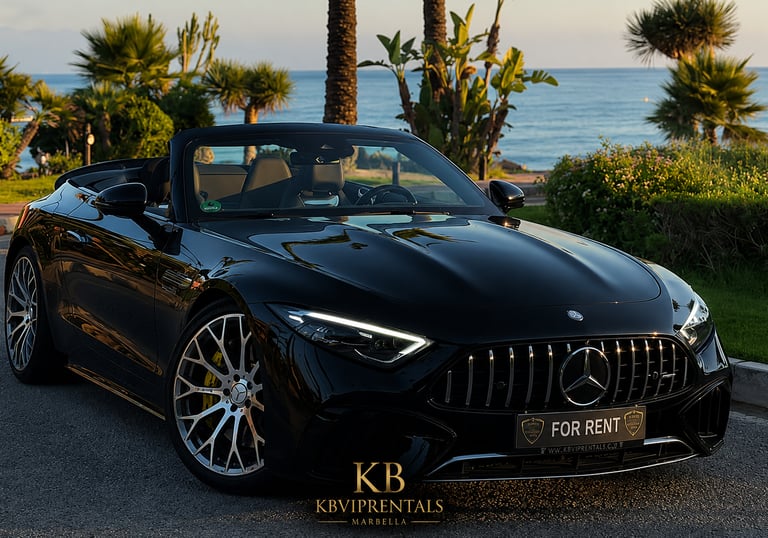 Black Mercedes-AMG SL convertible luxury car rental parked by the ocean at sunset in Marbella.