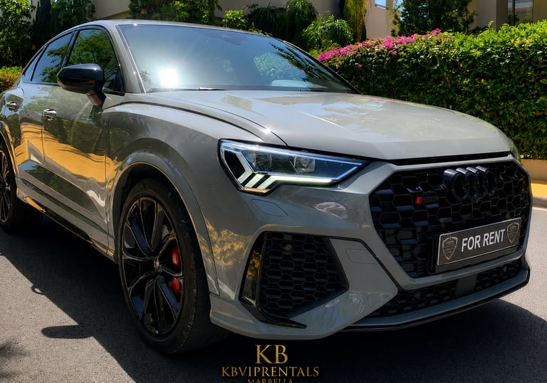 Luxury grey Audi RS Q3 Sportback for rent in Marbella with black wheels and red brake calipers.