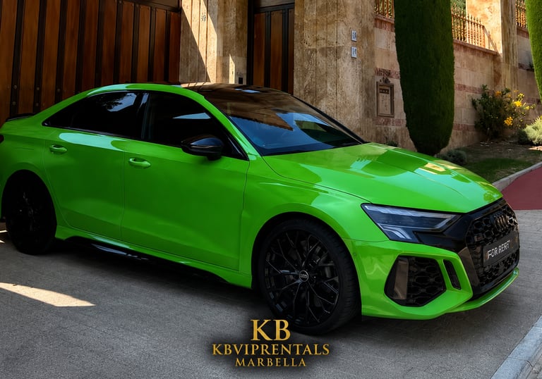 A bright Kyalami Green Audi RS3 luxury sedan parked in front of a stone villa for rent in Marbella.