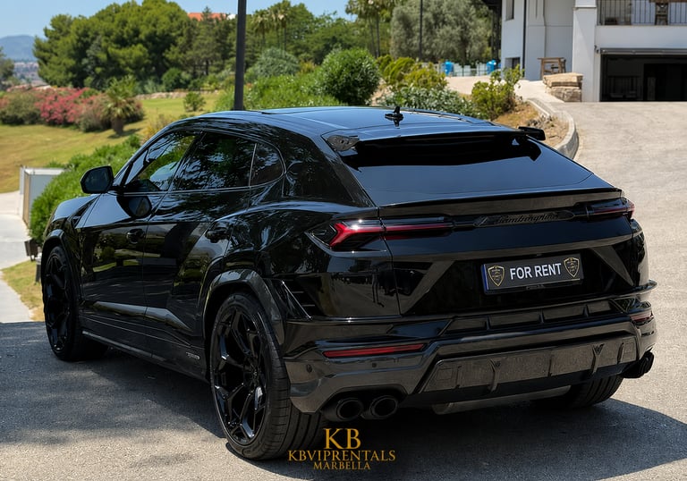 Black Lamborghini Urus luxury SUV available for rent in Marbella parked on a sunny driveway.