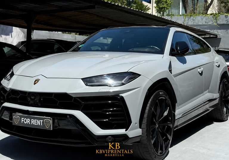 Luxury grey Lamborghini Urus SUV available for rent in Marbella, featuring black rims and sleek design.