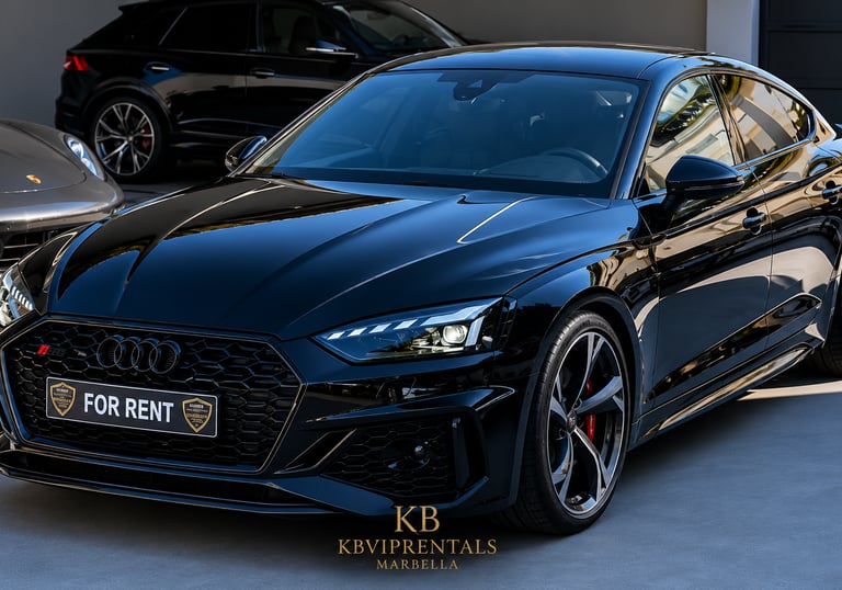 Black Audi RS5 Sportback luxury car rental in Marbella with sleek design and alloy wheels.