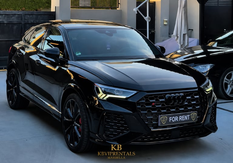 Sleek black Audi RS Q8 luxury SUV for rent, parked in Marbella with high-gloss finish and LED headlights.
