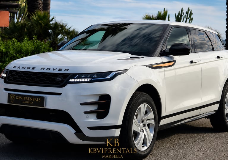 White Range Rover Evoque luxury SUV rental parked in Marbella with palm trees and a blue sky background.