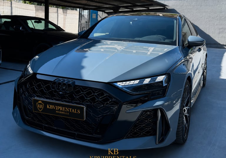 Luxury grey Audi RS3 sedan rental in Marbella with black honeycomb grille and LED headlights.