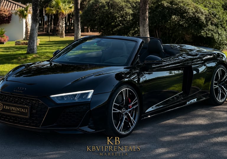 Black Audi R8 Spyder luxury convertible car for rent in Marbella, Spain.