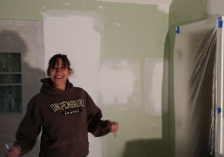 Janet Graybill showing off her work with a smile.