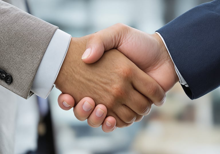 two people shaking hands with each other