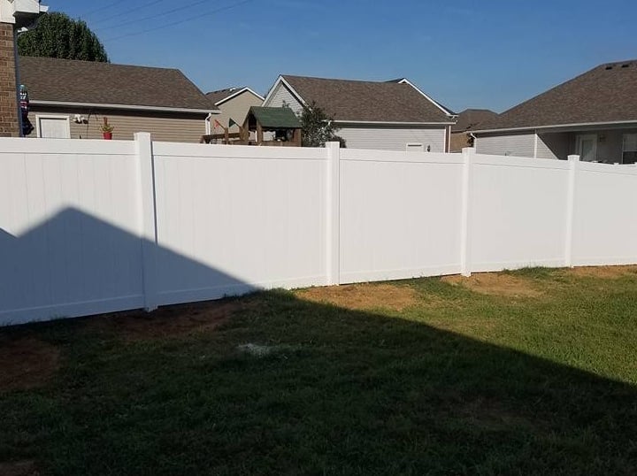 White vinyl residential privacy fence installed at a home in Central Kentucky