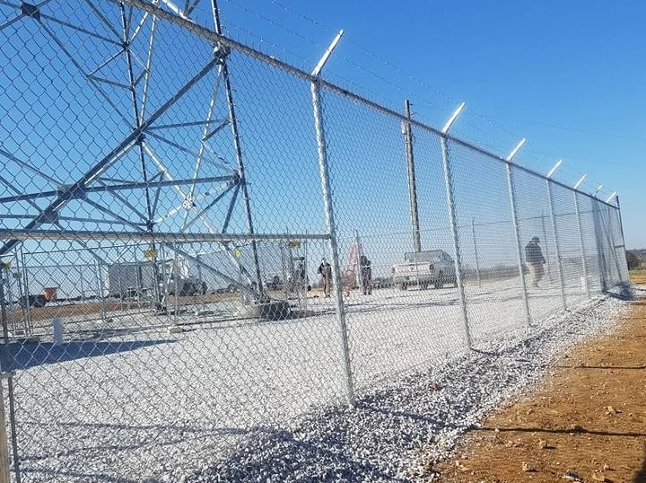 Commercial chain link fence with barbed wire installed for business security in Kentucky
