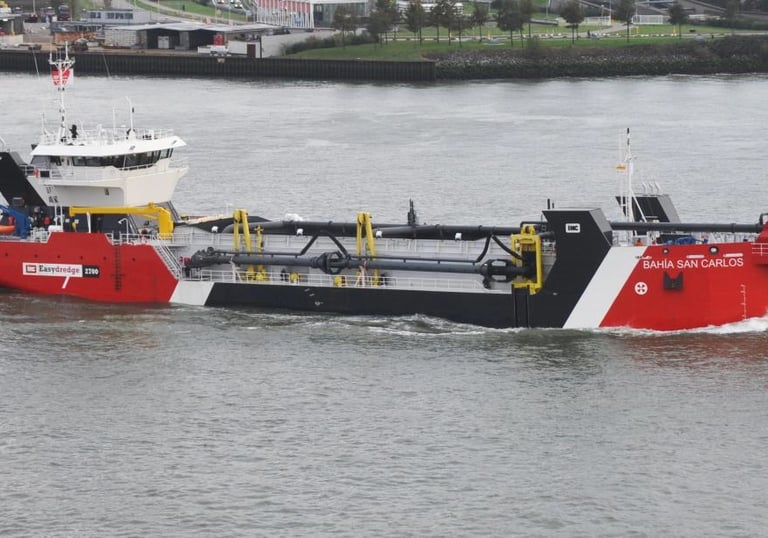 a boat with a red and white boat in the water