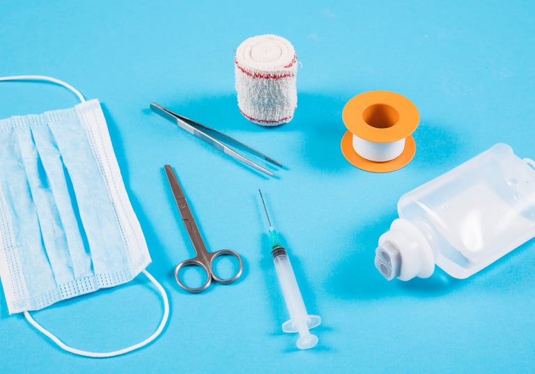 a variety of medical supplies including a bottle of liquid