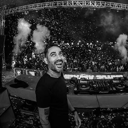 a Dj with a beard at concert of The Kabir Company