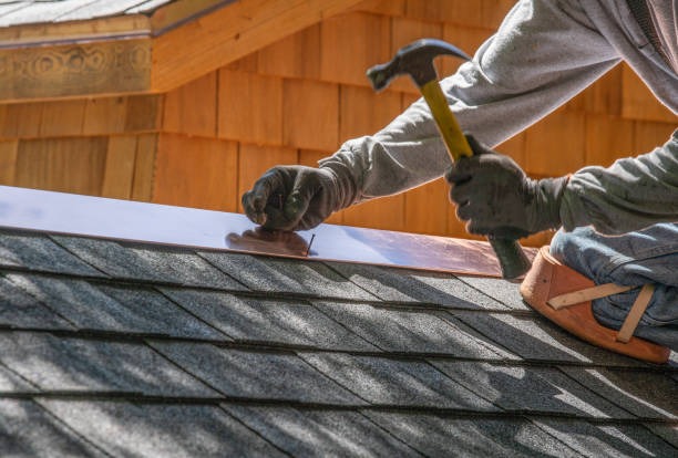 roofer hammering in nails